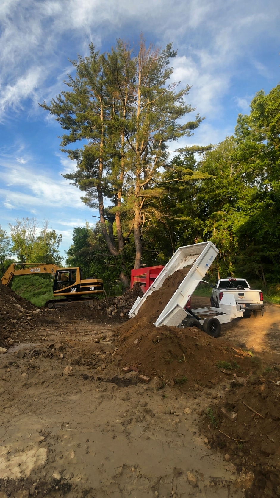Lavallee Landscaping trailer and large excavator